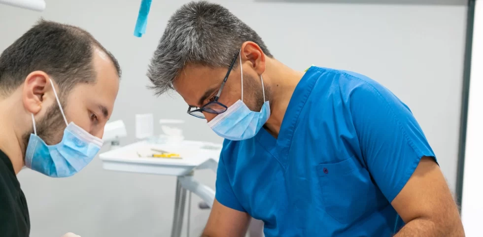Dentist Mehmet Fatih Sever treating a patient